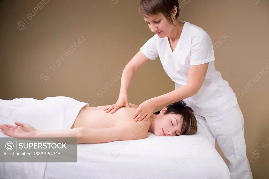 A Woman Getting A Massage From A Massage Therapist