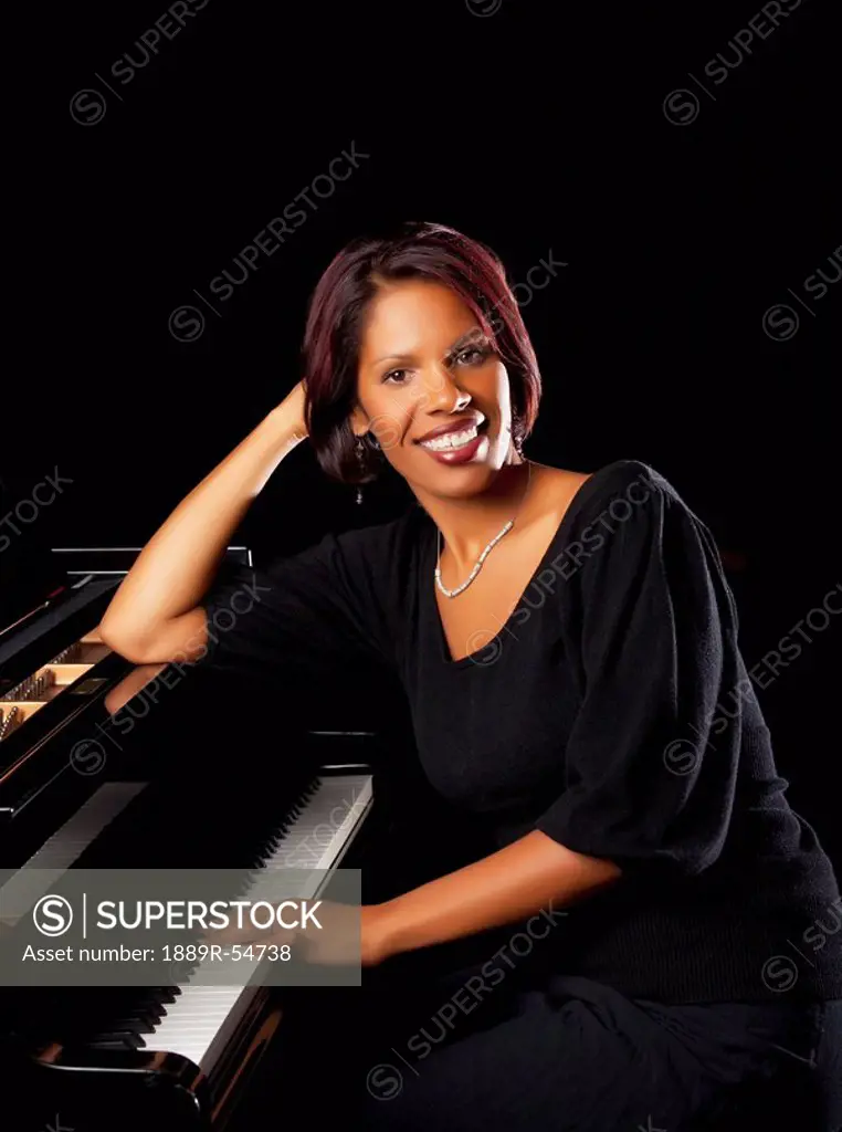 Fort Lauderdale, Florida, United States Of America, A Woman Sitting At The Piano