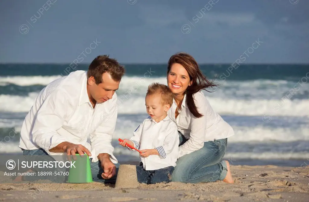 Fort Lauderdale, Florida, United States Of America, A Family Playing In The Sand On The Beach