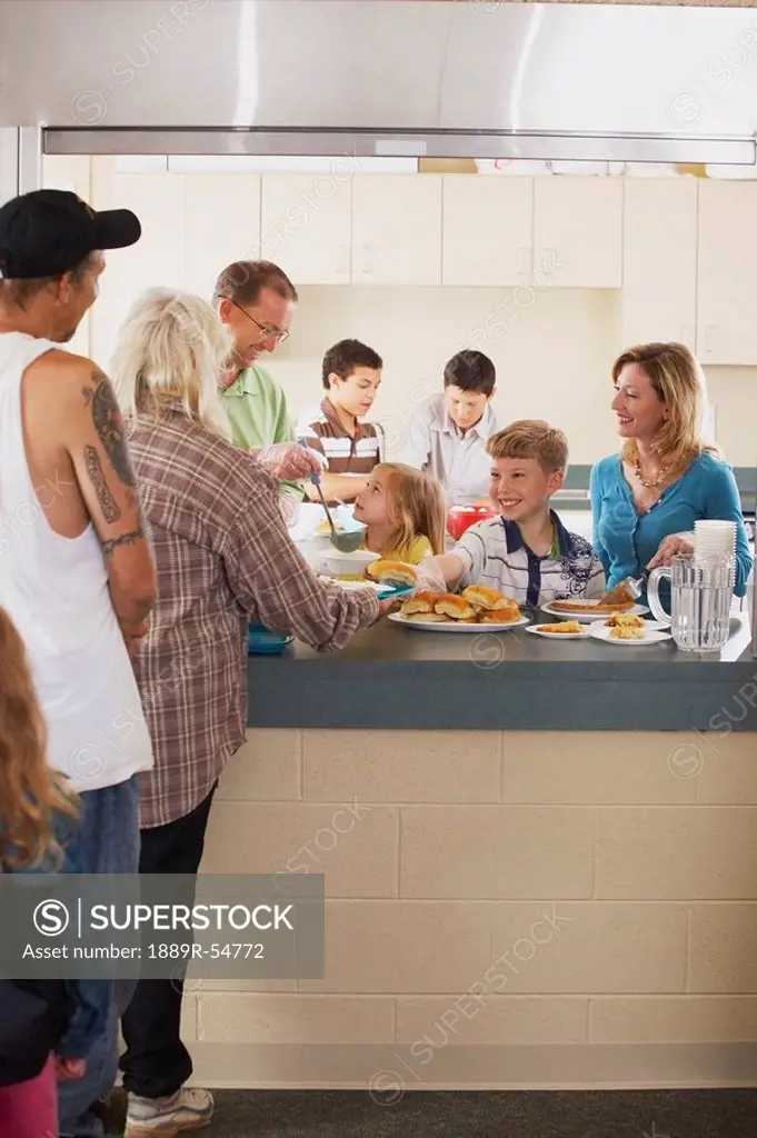 Knoxville, Tennessee, United States Of America, A Family Serving A Meal To Those In Need