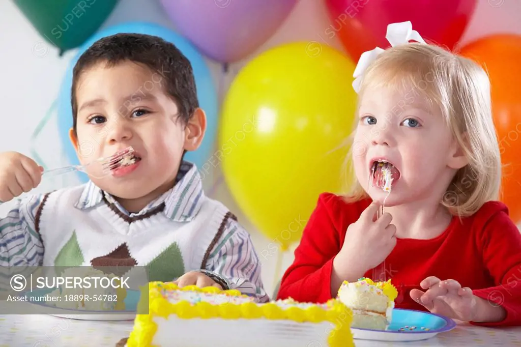 Knoxville, Tennessee, United States Of America, Two Children Eating Birthday Cake