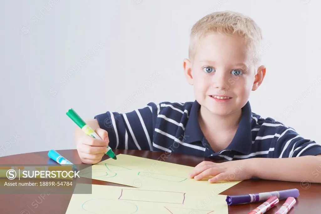 Knoxville, Tennessee, United States Of America, A Boy Coloring At A Table