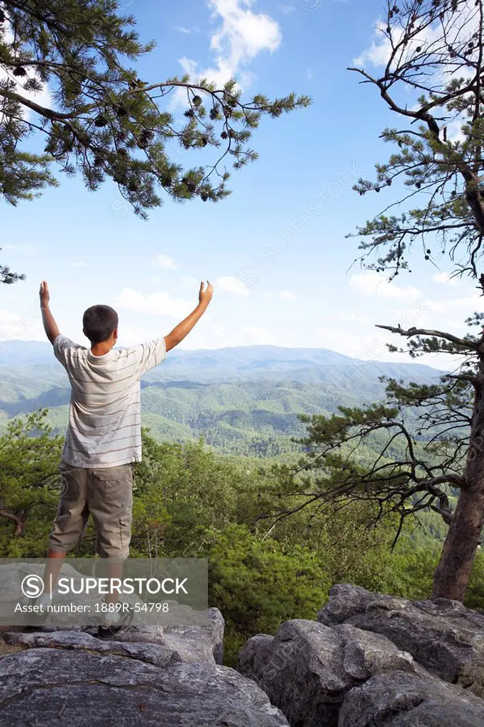 Knoxville, Tennessee, United States Of America, A Boy With His Arms Raised While Overlooking The Mountains