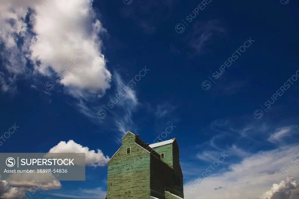Alberta, Canada, Clouds In The Sky Above A Grain Elevator
