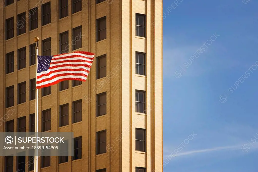 San Antonio, Texas, United States Of America, An American Flag In Front Of A Building