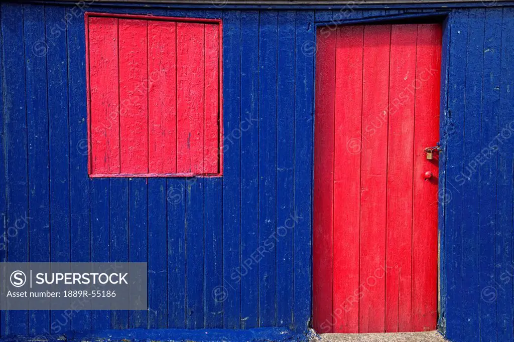 St. abb´s head, scottish borders, scotland, a red door and window on a blue wooden building