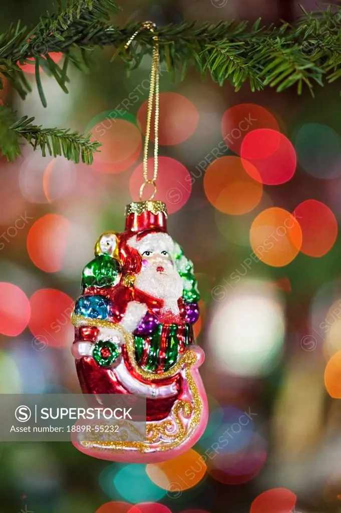 oregon, united states of america, a santa claus ornament hanging from a christmas tree