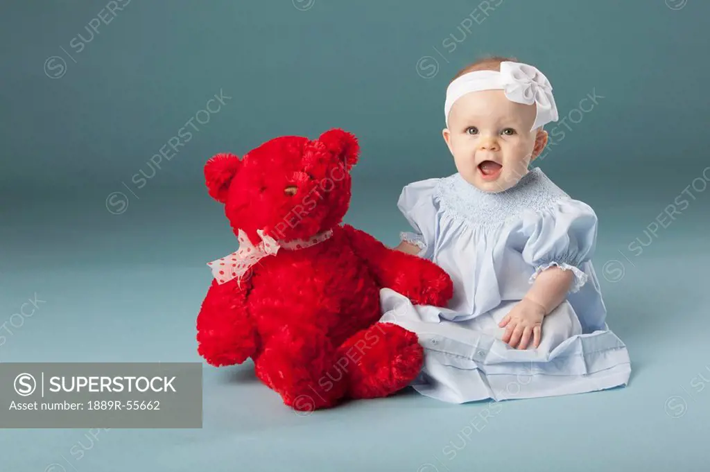 baby girl with a teddy bear