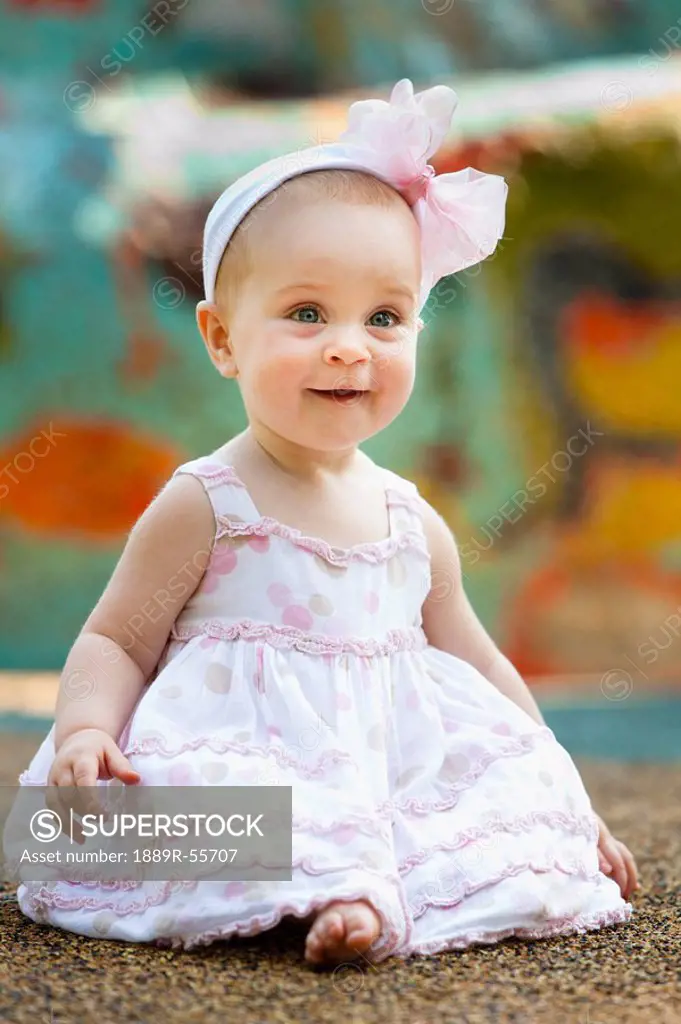 baby girl with a bow in her hair smiling, nashville, tennessee, united states of america