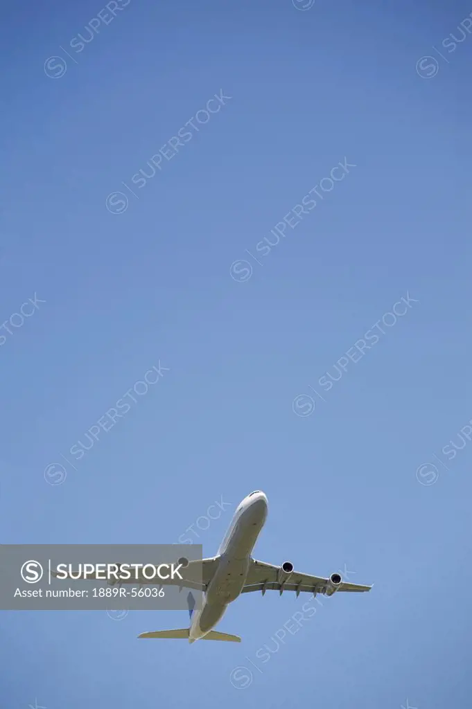 commercial airplane in flight, calgary, alberta, canada