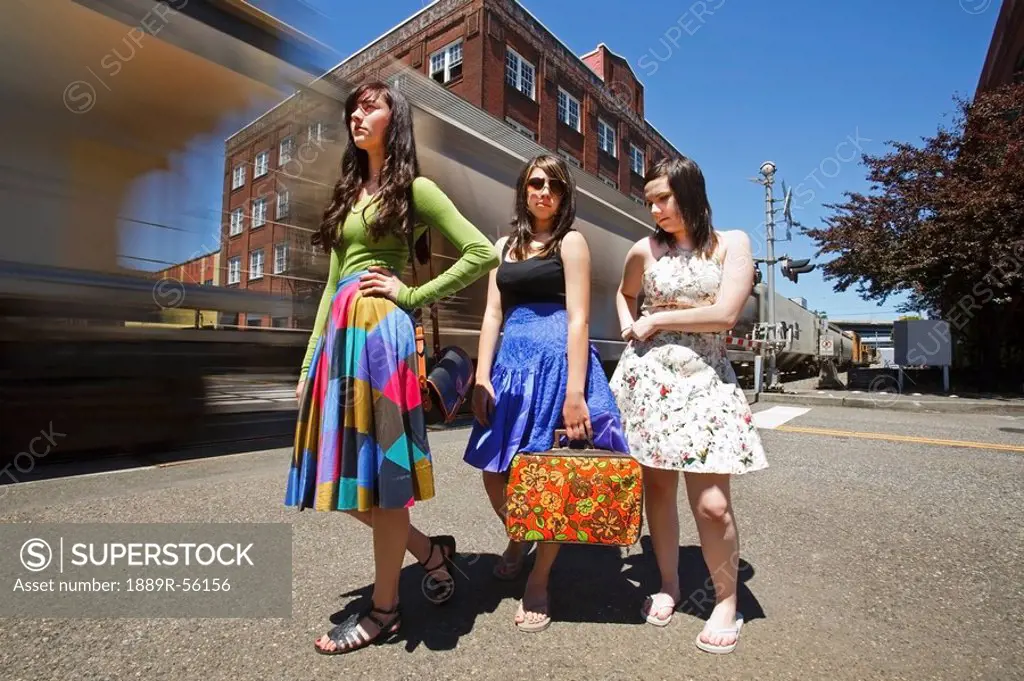 teenage girls waiting for a train in downtown, portland, oregon, united states of america