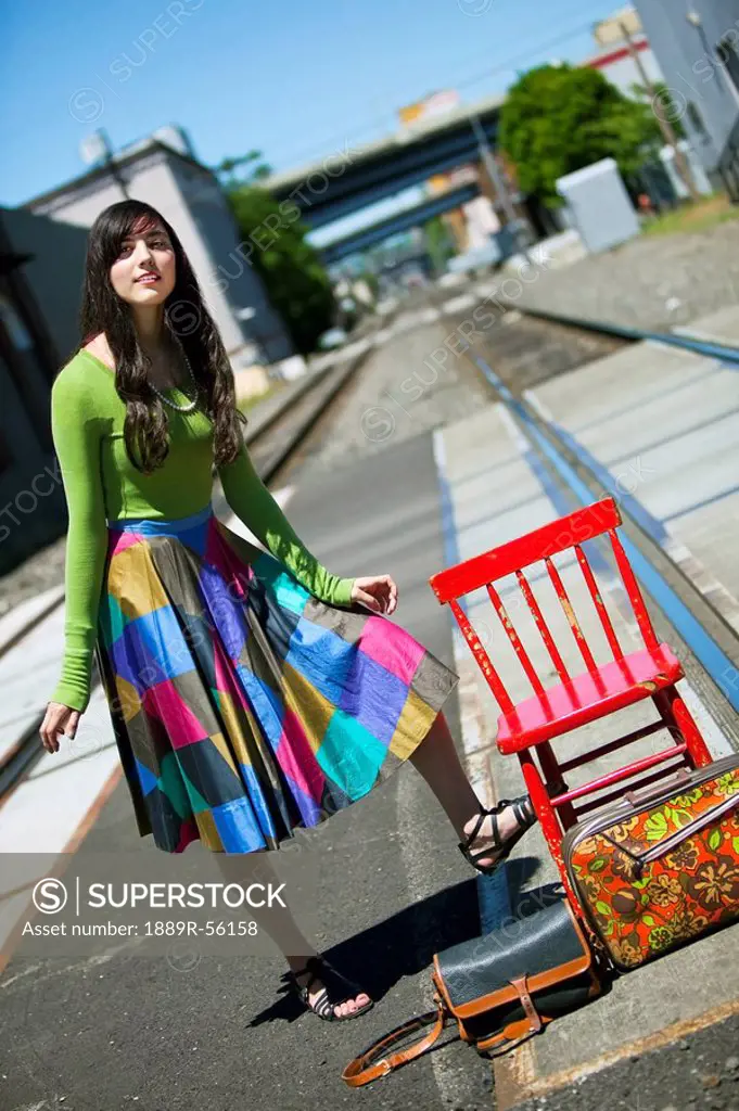 teenage girl waiting for the train in downtown: portland, oregon, united states of america