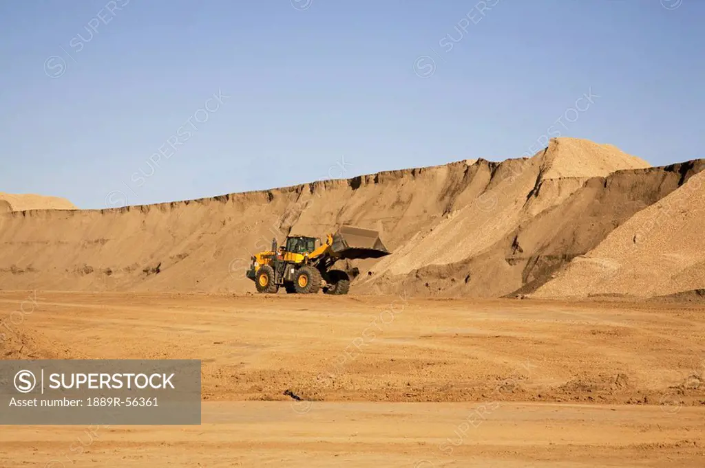 edmonton, alberta, canada, moving dirt on a construction site