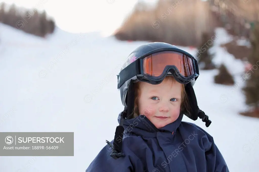 red deer, alberta, canada, a young boy wearing a helmet and ski mask
