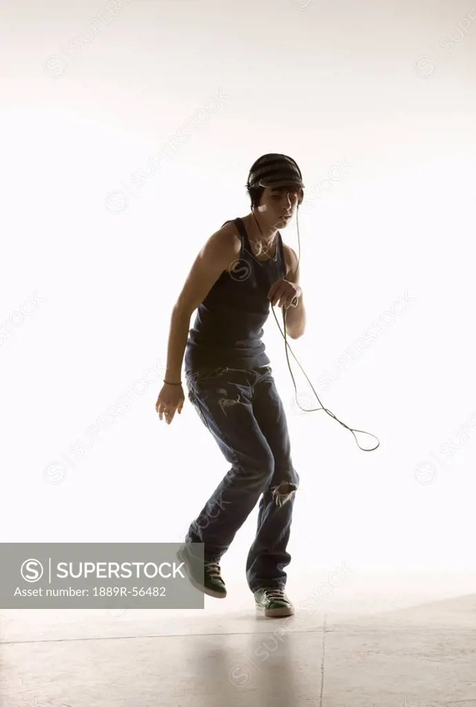 a boy dancing with headphones