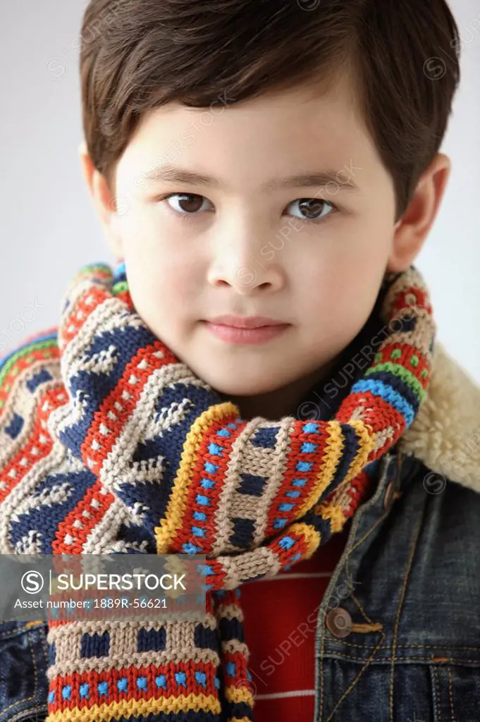 young boy wearing a scarf