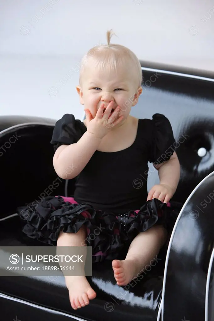 a young girl yawning in a chair, gresham, oregon, united states of america