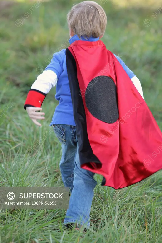 young boy playing outdoors with a cape, portland, oregon, united states of america