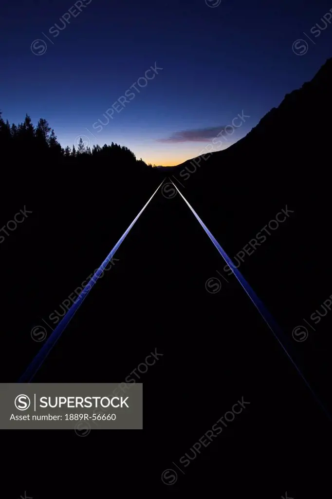 train tracks at sunset, banff, alberta, canada