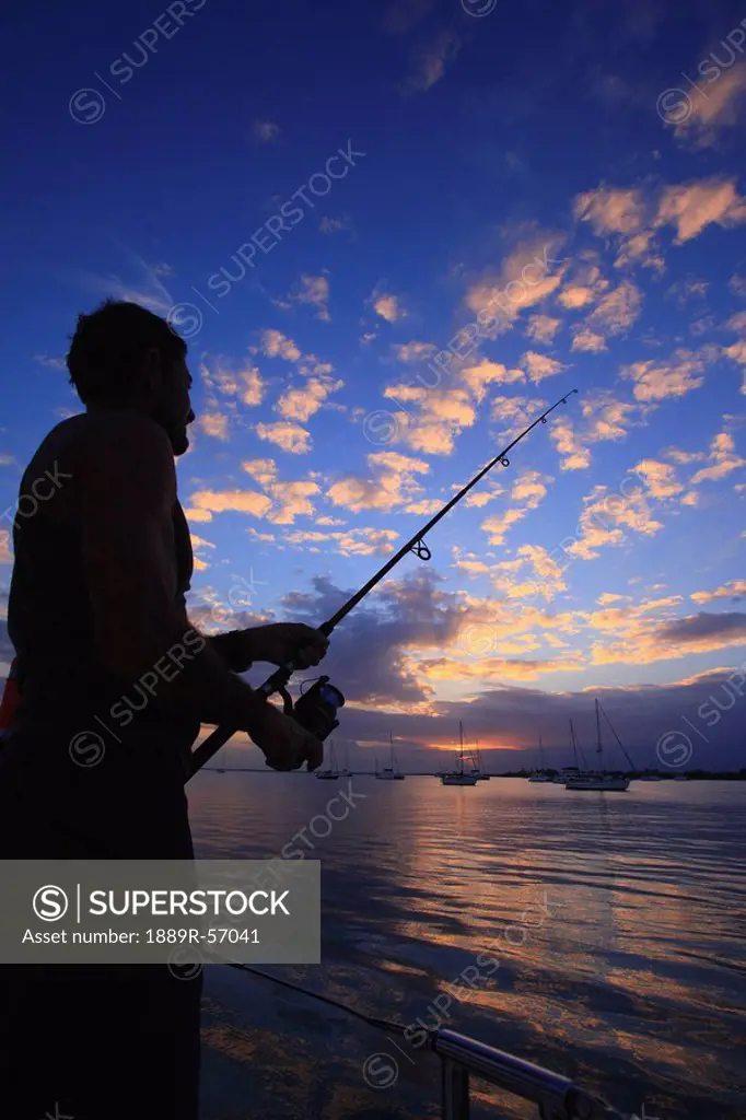 a man fishing, belize
