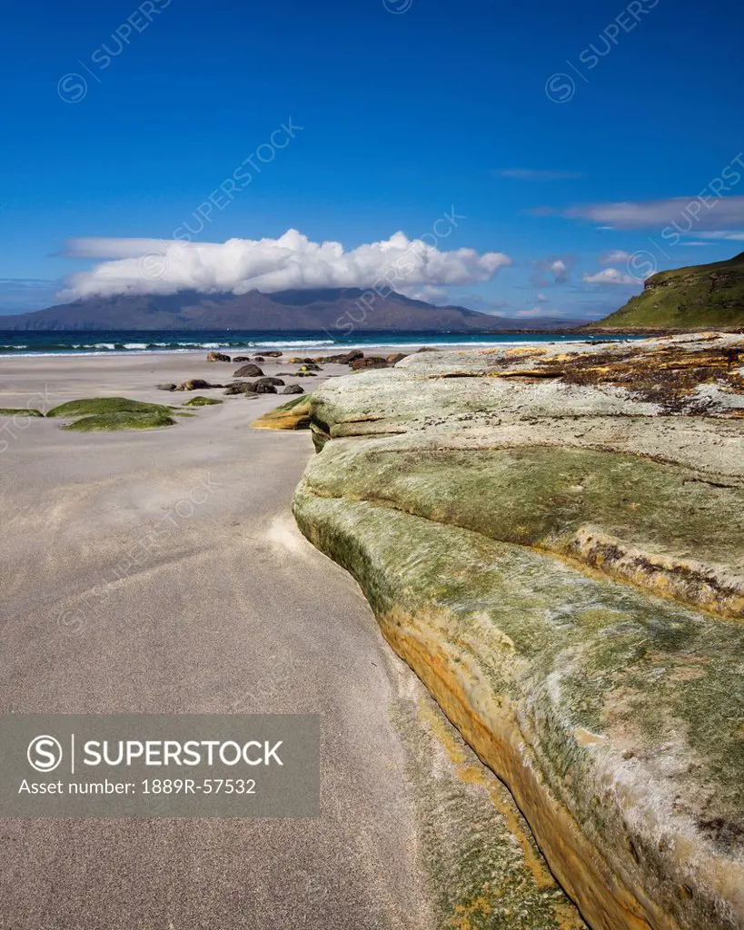 view across the sound of rum from the singing sands, eisle of eigg, lochaber, highlands, scotland