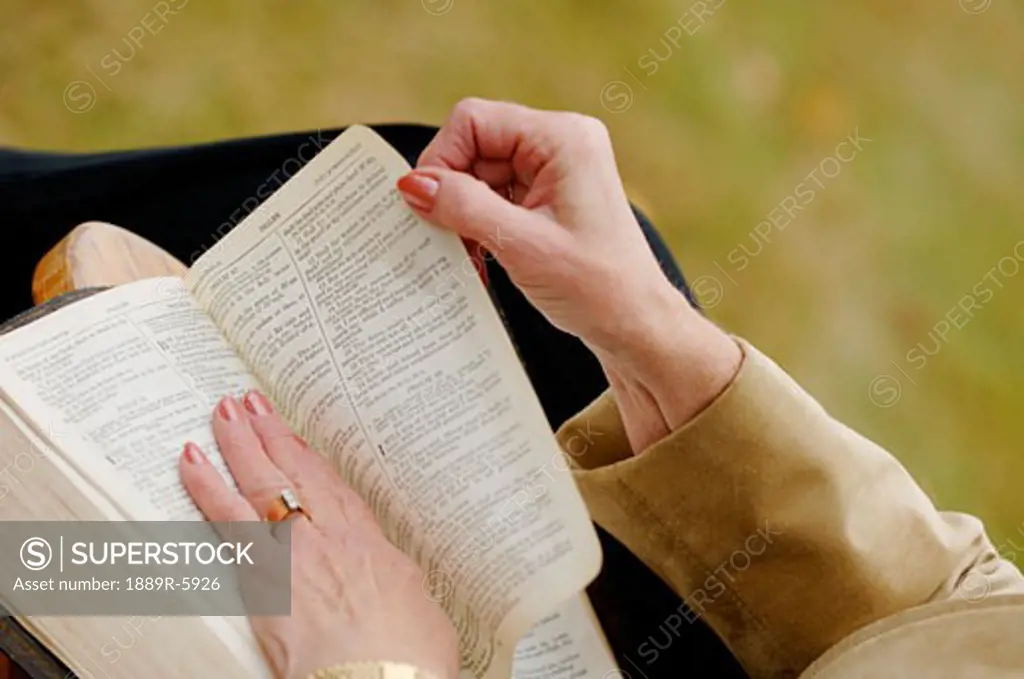Closeup of woman reading Bible