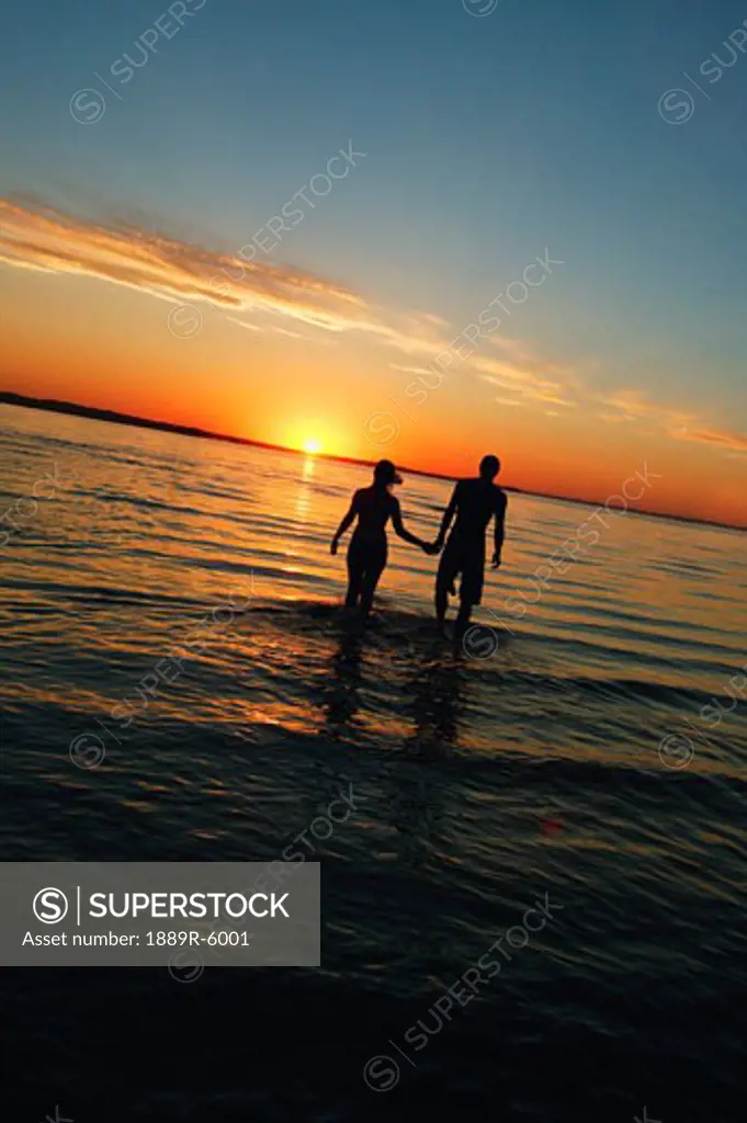 A couple walking in the water