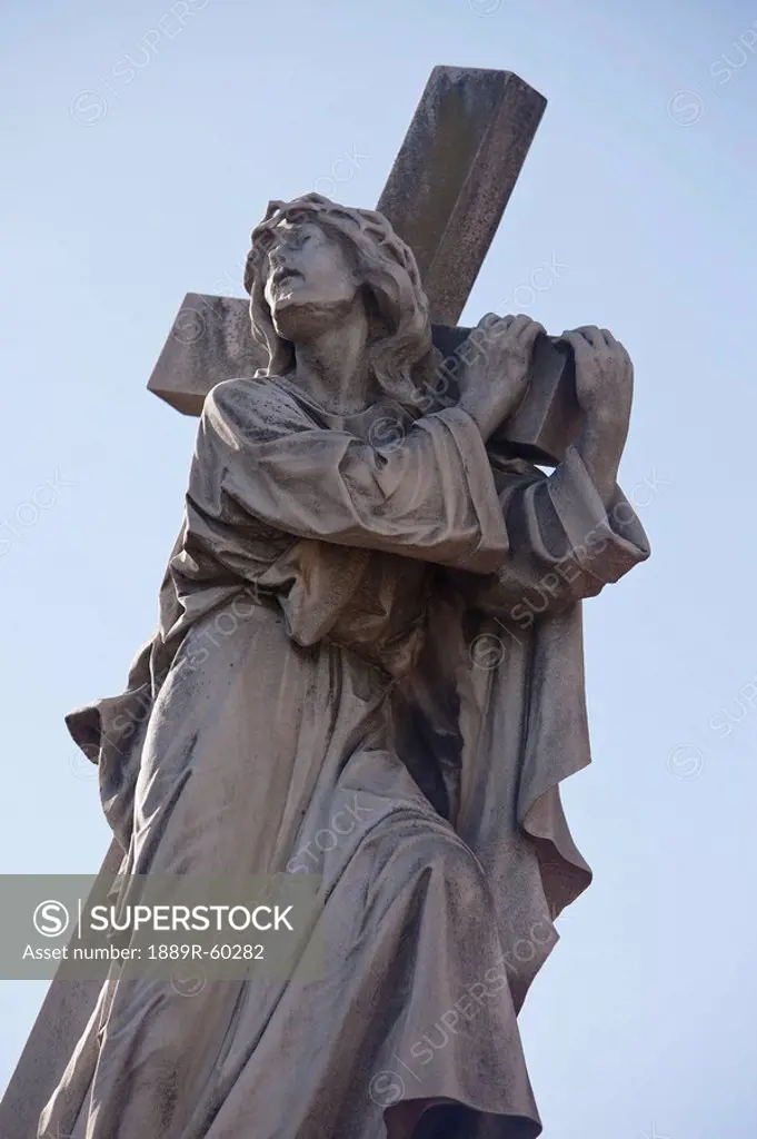Buenos Aires, Argentina, A Stone Statue Of Jesus Carrying His Cross In Recoleta Cemetery