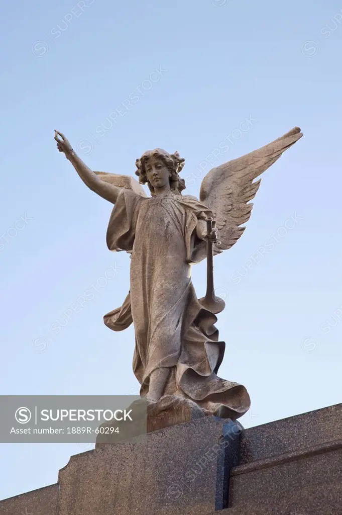 Buenos Aires, Argentina, A Stone Statue Of An Angel In Recoleta Cemetery