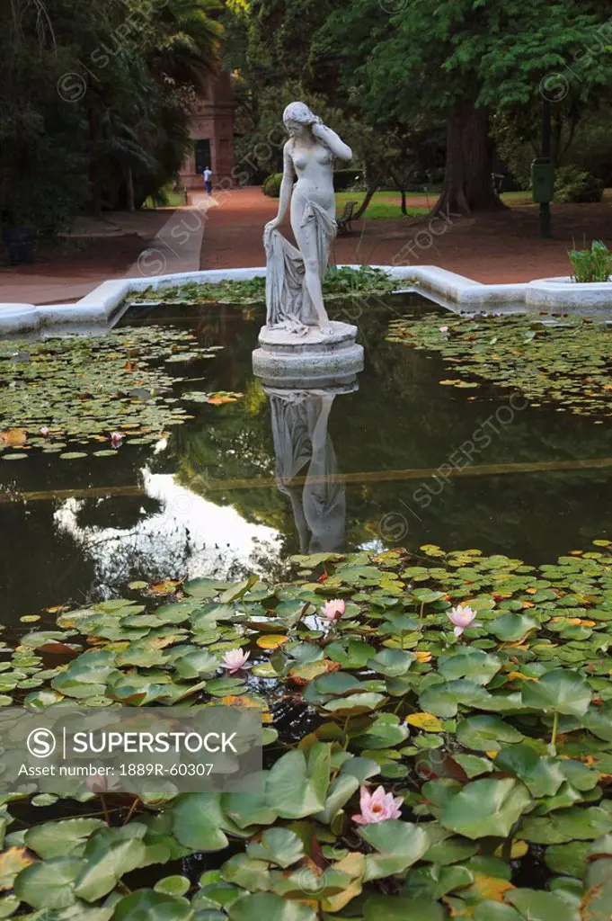 Buenos Aires, Argentina, A Stone Statue In A Pond In The Palermo Botanical Gardens Jardin Botanical