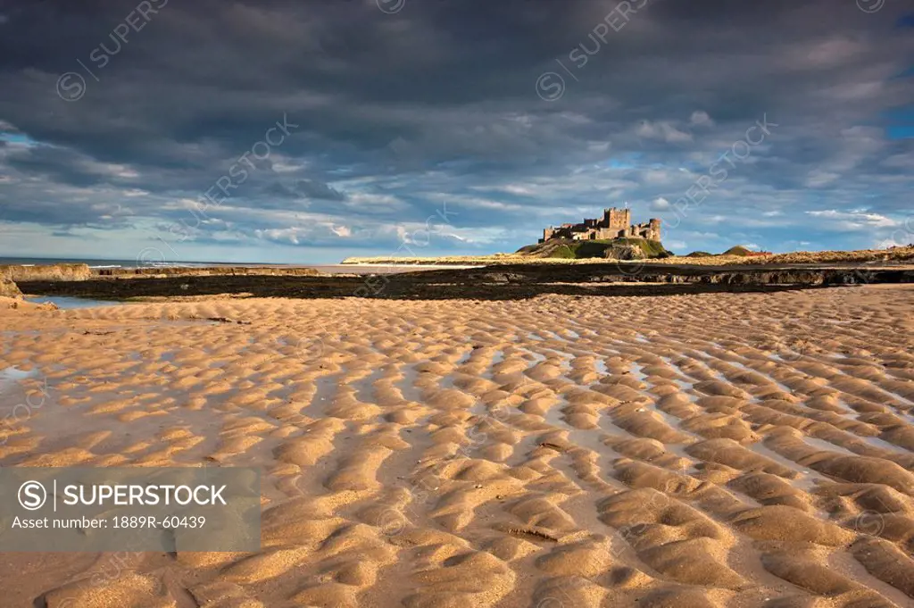 Bamburgh, Northumberland, England, View Of Bamburgh Castle From A Sandy Beach
