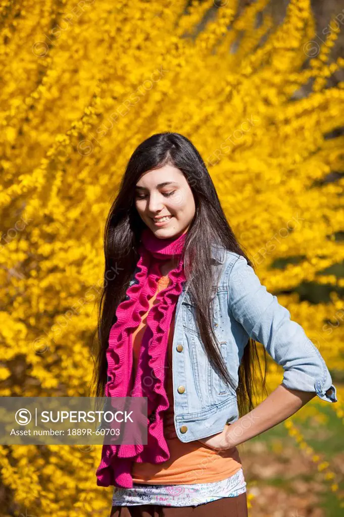 Portland, Oregon, United States Of America, A Teenage Girl Poses In Front Of A Tree With Autumn Colors In Portland Park