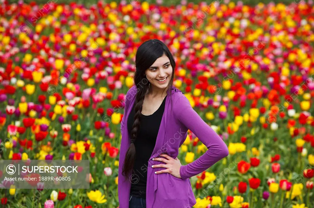 Woodburn, Oregon, United States Of America, A Teenage Girl Poses In Front Of A Tulip Field At Wooden Shoe Tulip Farm