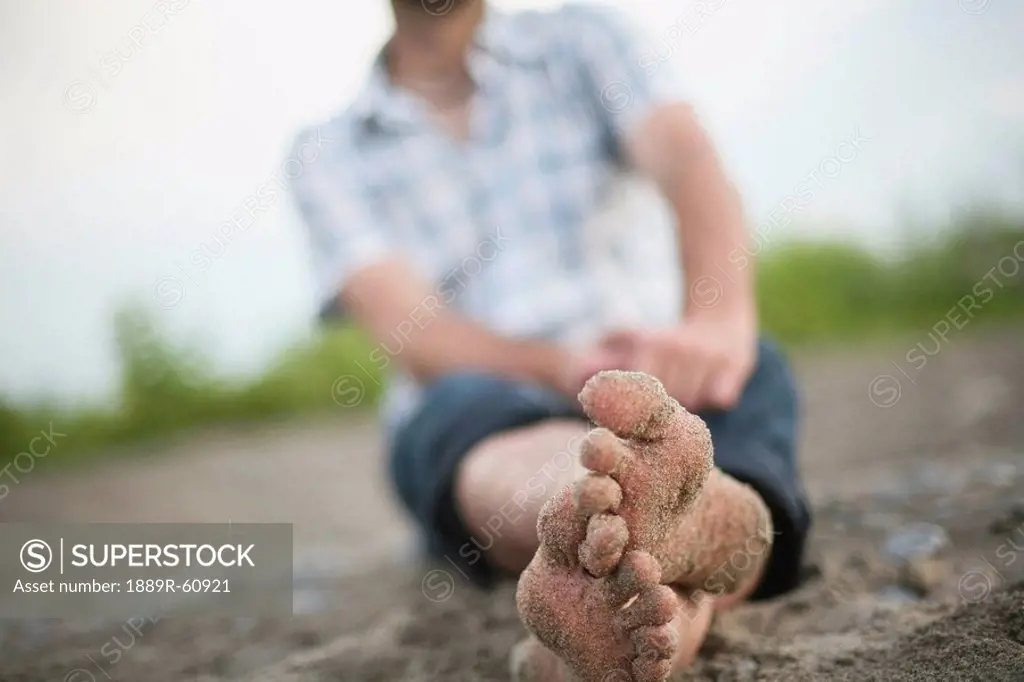 Stoney Creek, Ontario, Canada, Bare Feet Covered In Sand