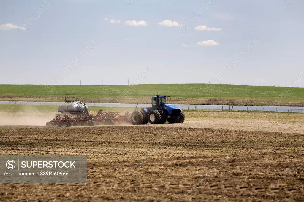 Calgary, Alberta, Canada, An Air Seeder Seeding A Field In The Spring
