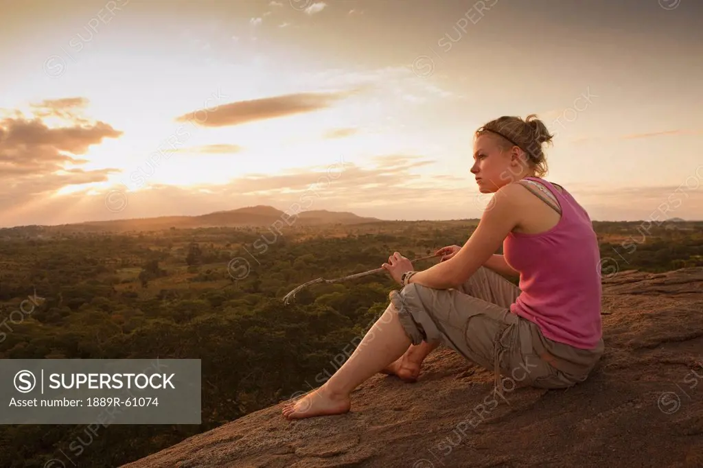 A Young Woman Looking Over The African Landscape, Manica, Mozambique, Africa
