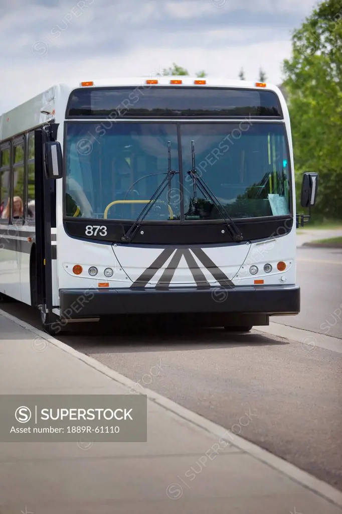 A Bus Parked Along A Curb, St. Albert, Alberta, Canada