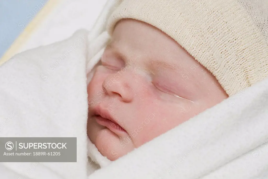 A Newborn Baby Wearing A Cap, Millet, Alberta, Canada