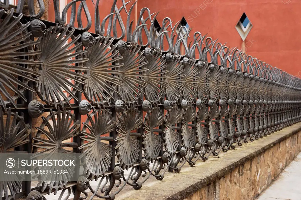 Ornate Fence In Park Güell, Barcelona, Spain