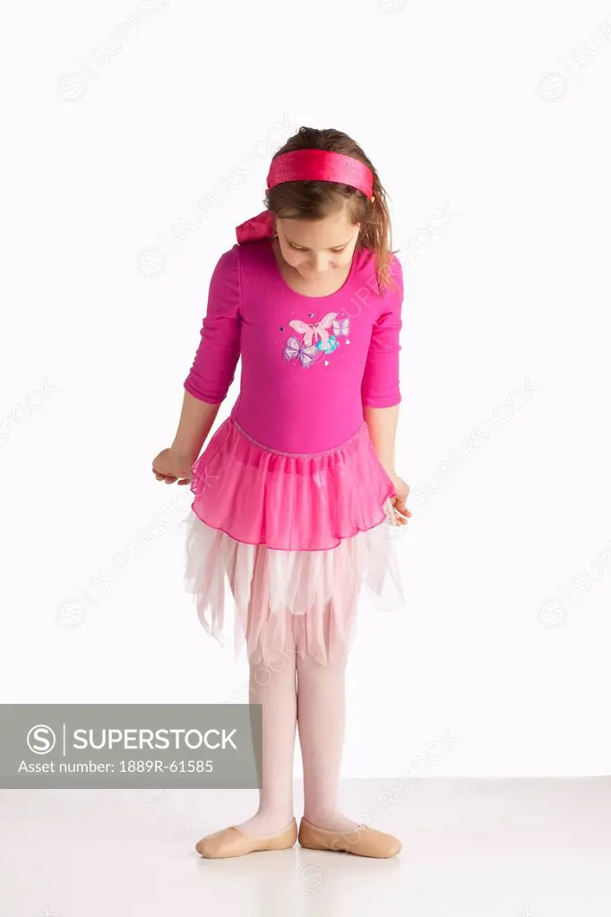 A Girl Wearing Ballet Shoes In A Ballet Pose
