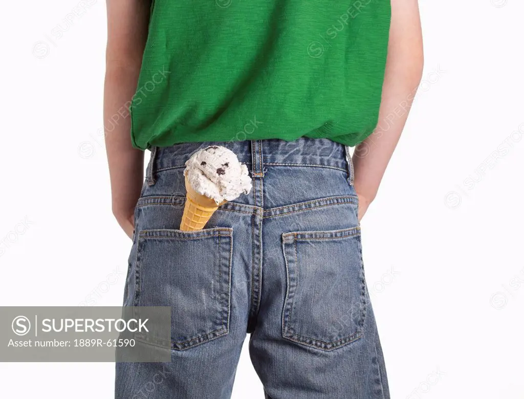 A Boy With An Ice Cream Cone In His Back Pocket