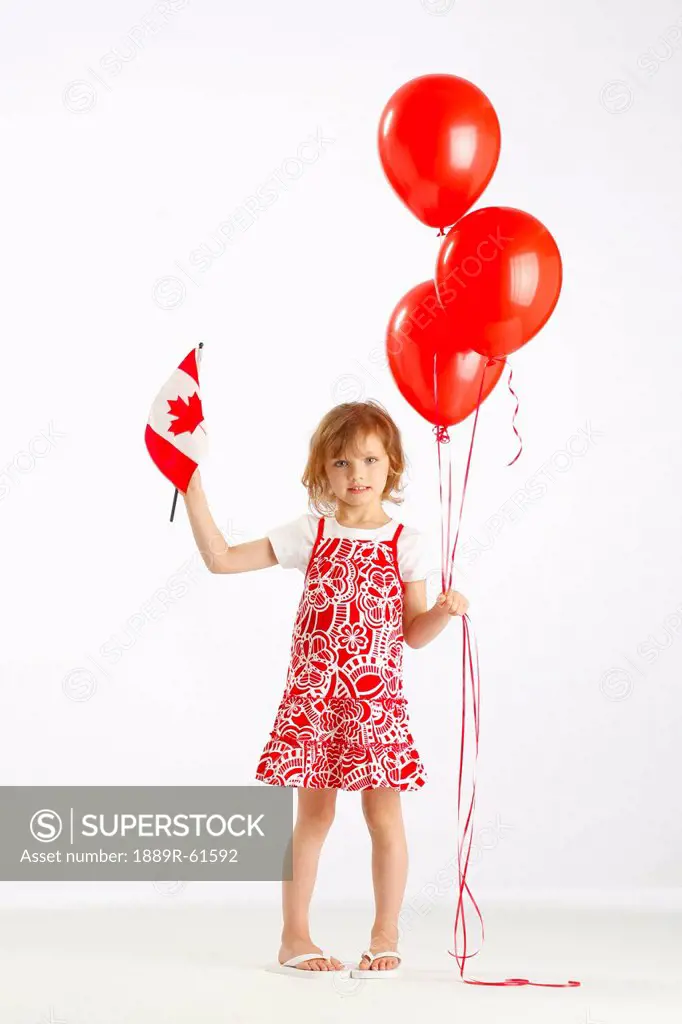 A Girl Holding Red Balloons And A Canada Flag