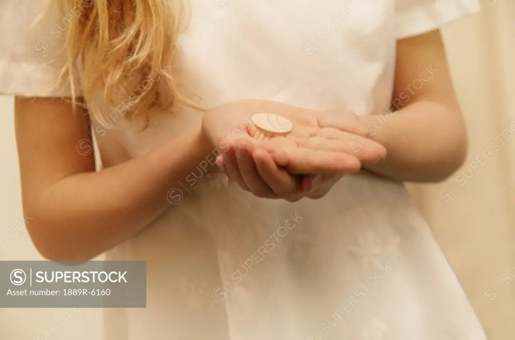Closeup of child holding sacrament
