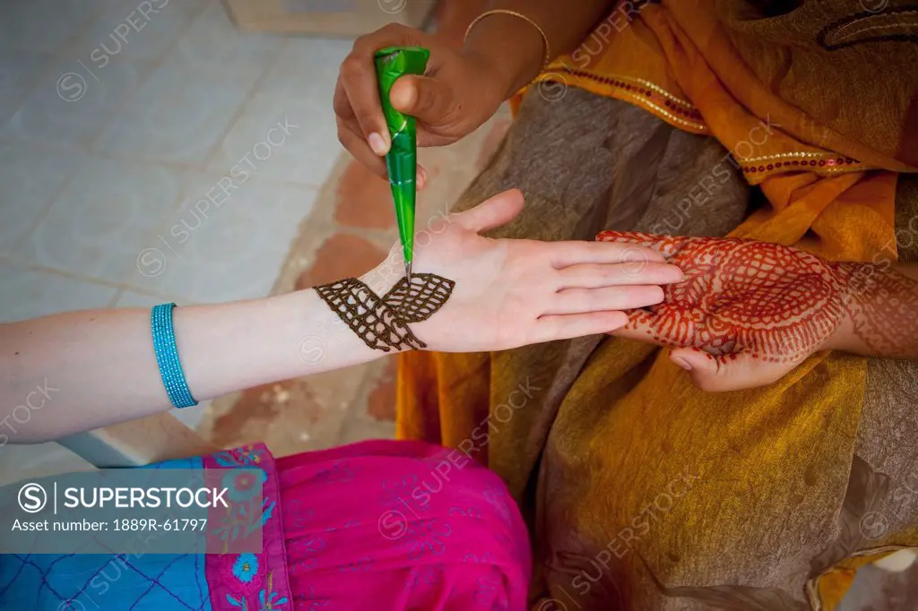 A Woman Doing Henna Painting On Another Woman´s Arm, Sathyamangalam, Tamil Nadu, India