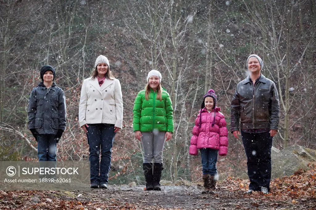 a family portrait in a snowfall, grimsby, ontario, canada