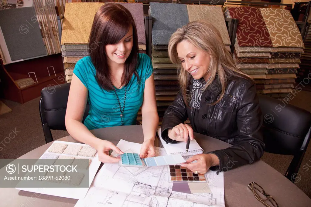design consultant assisting a customer in a retail flooring store, edmonton, alberta, canada
