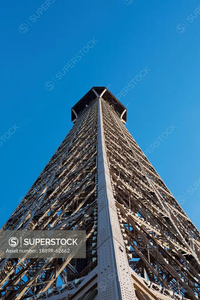 low angle of the eiffel tower against a blue sky, paris, france