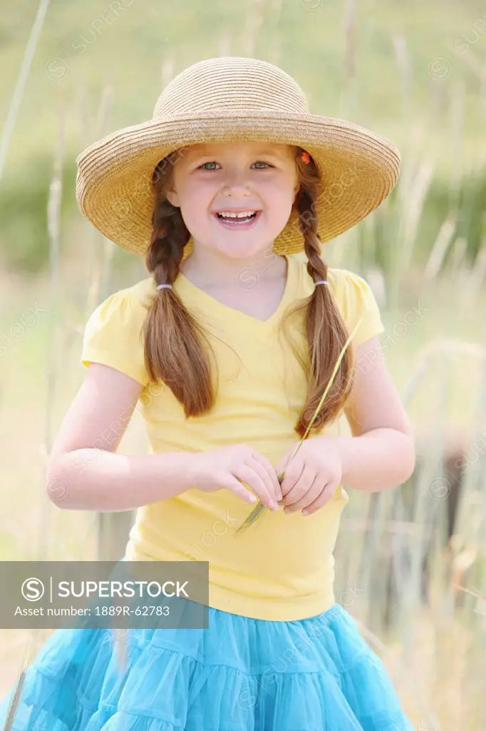a girl wearing a straw hat, troutdale, oregon, united states of america