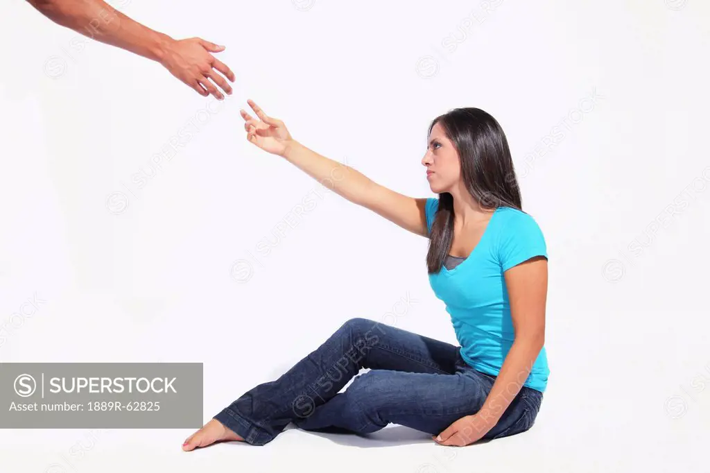 a hand reaching out to help a woman get up