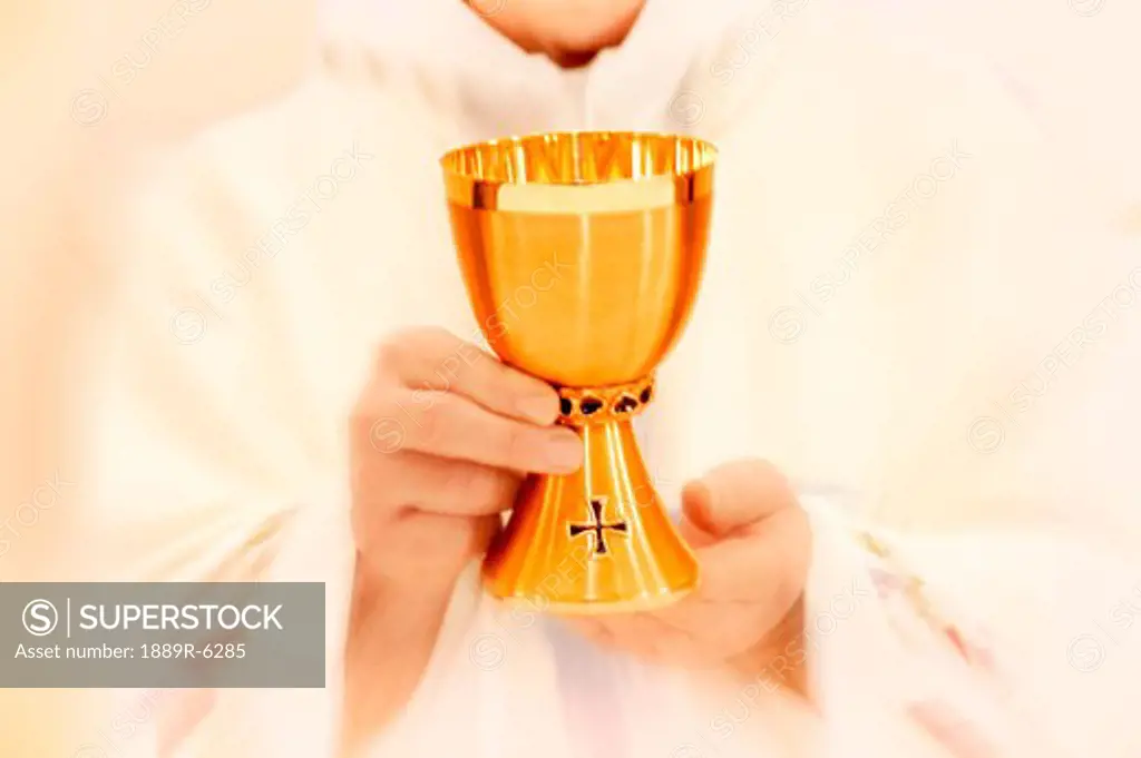 Priest holding the wine